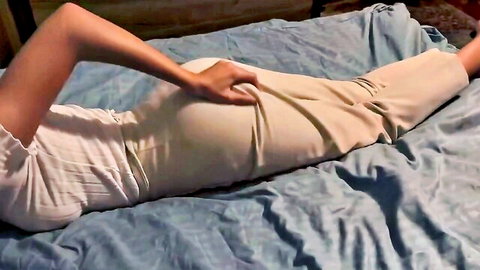 Petite olive-skinned girl's tight ass grabbed by hand with pants pulled down on bed