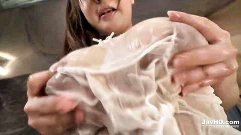 Japanese babe with huge cum-drenched tits squeezes her messy boobs POV