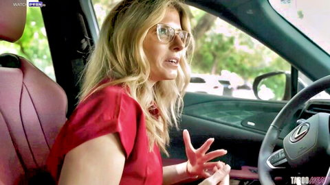 Cory Chase as blonde stepmom gesturing in car on vacation