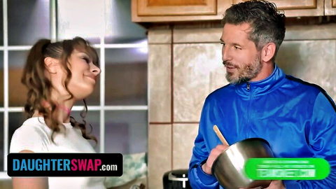 Skinny brunette teen in white tank top smiles up at DILF stepdad stirring pot in taboo kitchen tease