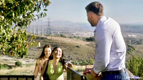 Brunette and Asian babes in skimpy tops tease handsome guy outdoors overlooking hills