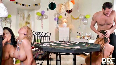 Muscular studs roughly grab hair of busty topless babes with huge tits at festive poker table orgy