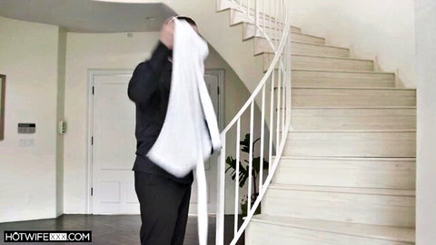 Blindfolded man in black outfit from Hot Wife XXX hotwife fun scene