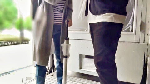 Mature Japanese woman in gray coat and stripes walking with man, Magic Mirror Mom Massage JAV preview