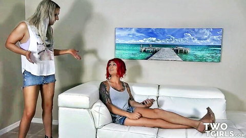 Blonde and redhead trans women lounging in tank tops and shorts