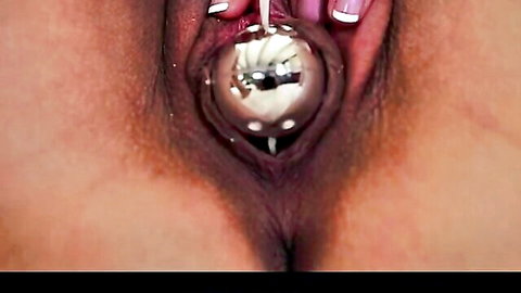 Lily Love in explicit vaginal speculum play with balls