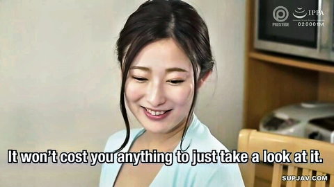 Smiling Japanese woman in light blue top, teasing kitchen glance