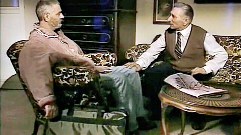 Mature men in suited conversation from The Fisherman's Wife (1994, Emma Rush)