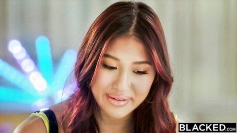Seductive Asian babe with glossy pink lips and wavy red hair closeup from Blacked