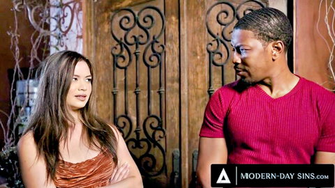 Interracial brunette beauty with cleavage flirts intensely with handsome black stud by ornate doors