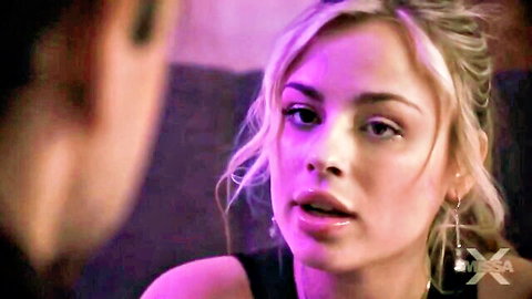 Seductive blonde Anna Claire in close-up gaze, black top