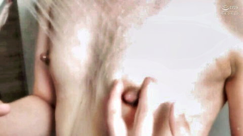 Wet JAV shemale soaping pierced breasts in shower