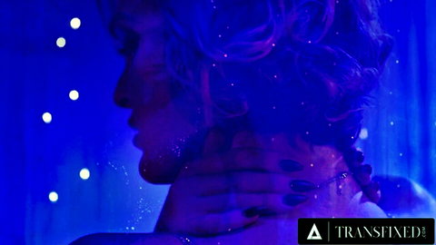 Tori Easton and Hazel Moore in ethereal blue-lit lesbian embrace, astral goddesses theme
