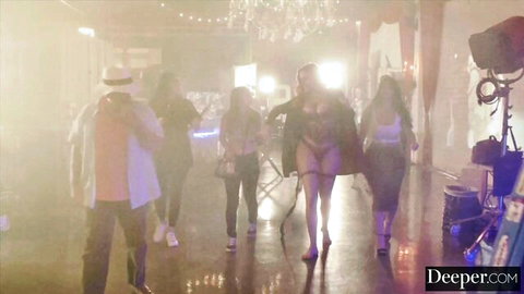 Curvy women in thongs and crop tops strutting on foggy porn set