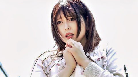 Surprised Japanese girl in floral sweater clasps hands pleadingly with cute face