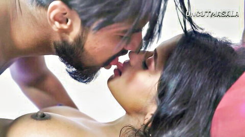 Indian couple in passionate morning kiss, topless woman in intimate embrace
