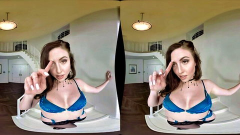 Nikkita in sexy blue lingerie posing with peace signs
