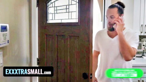 Handsome man with man bun talks on phone at door in Exxxtra Small petite teen scene
