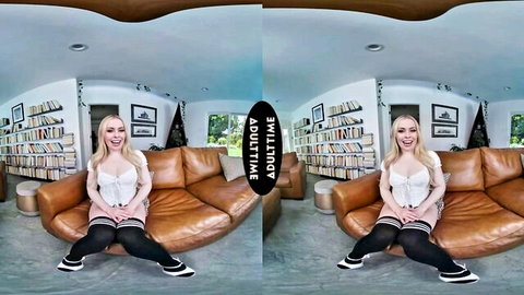 Haley Spades in white lingerie and stockings, smiling seductively in POV VR on couch