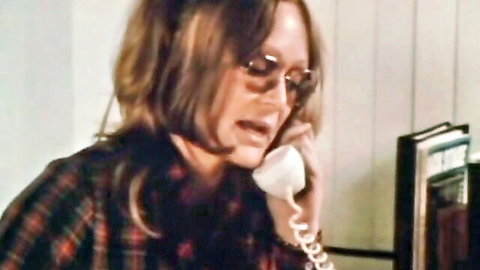 Georgina Spelvin talking on phone in vintage 1973 retro porn scene