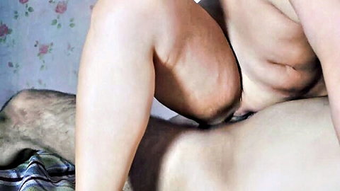Amateur woman straddles boyfriend's hairy crotch in cowgirl, shaved pussy spread wide visible