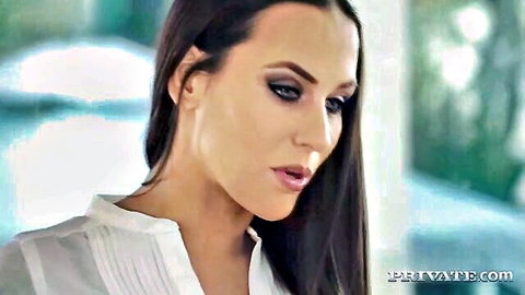 Seductive brunette with glossy plump lips and smokey eyes in white blouse closeup