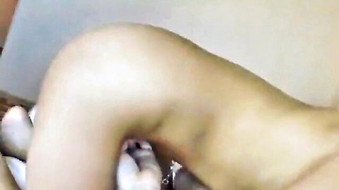 Pale-skinned woman in white socks giving close-up blowjob