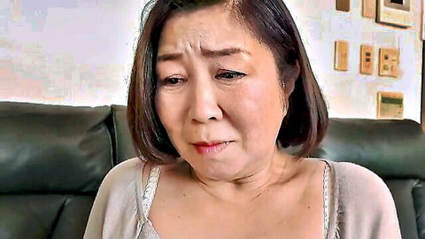 Mature Asian woman with sad expression on couch, TMRD-1177 JAV thumbnail