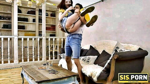 Redhead stepsis playfully carried on stepbro's shoulders in teasing encounter