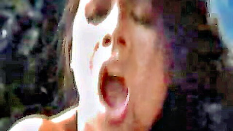 Tera Patrick in ecstatic close-up during anal scene, mouth agape in pleasure