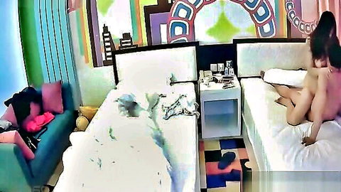 Nude Asian woman spreading legs with dildo on hidden cam