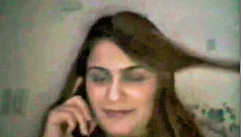 Brunette Turkish webcam girl dirty talking on phone smiling seductively