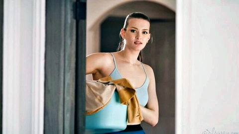 Brunette cleaner in tank top and leggings holds bucket, surprised expression