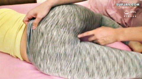 Asian stepsister's ass exposed as hands pull down gray leggings for anal tease