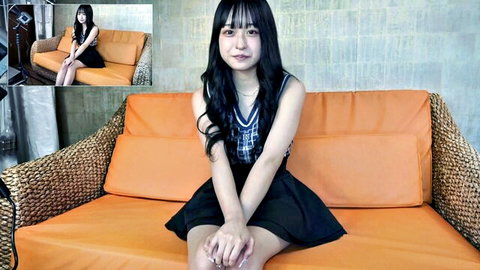 Petite Asian schoolgirl in plaid skirt and blouse, sitting teasingly solo