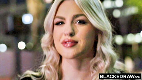 Blonde stunner Jazlyn Ray smiles seductively in city night lights