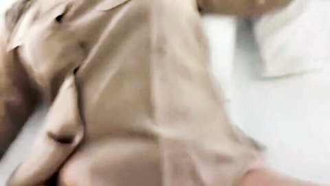 Woman's bare juicy ass exposed with khaki pants pulled down to knees on bed