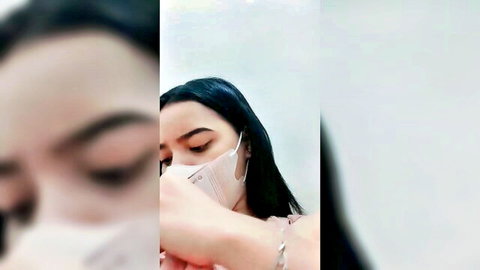 Blurry close-up of Asian woman in surgical mask and pink top, mysterious vibe