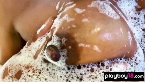 Misty Stone ebony MILF in bubbly bath with exposed breasts