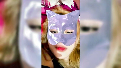 Jessika Intan teasing in shiny purple cat mask, blonde hair