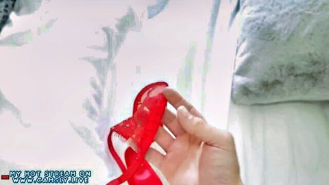 Step sister holds red lace panties in teasing live stream