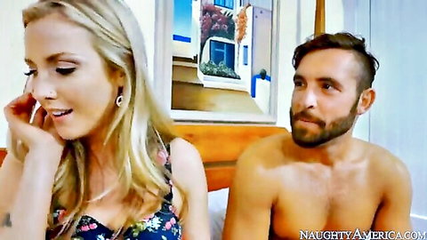 Blonde girlfriend seductively touches lips teasing blowjob while looking back at shirtless bearded hunk on bed