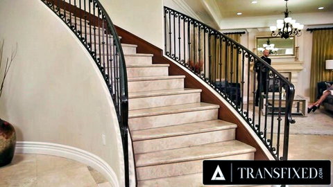 Luxurious curved marble staircase in upscale Transfixed trans porn mansion interior