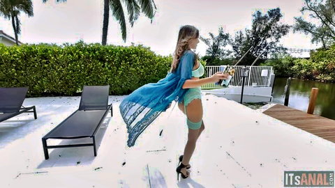Armani Black posing in sheer blue lingerie and stockings outdoors