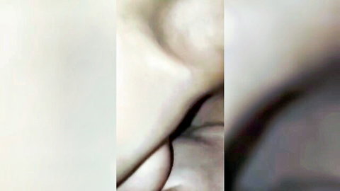 Blurry close-up of pale-skinned woman shoulder and neck