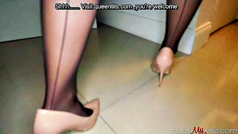 Sexy legs in seamed black nylons and nude high heels walking teasingly on floor