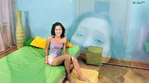 Aspen Richardsen smiling on bed in pink shorts and top