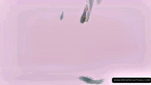 Skinny young brunette with long hair has thick cum dripping from open mouth onto exposed tits in casting