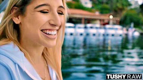 Abella Danger smiling seductively in Tushy Raw outdoor teaser