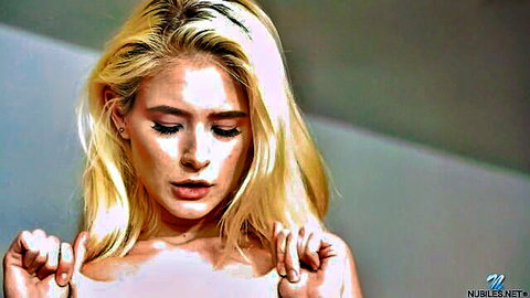Blonde Jessie Saint topless with hands on breasts in solo scene